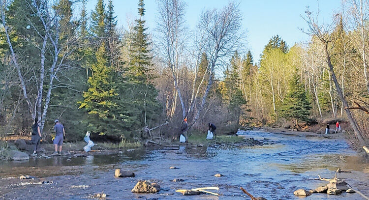 More than 155 pounds of trash found alongside river